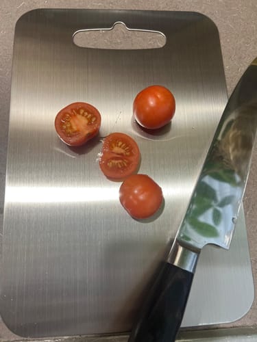 Apple slices on titanium cutting board